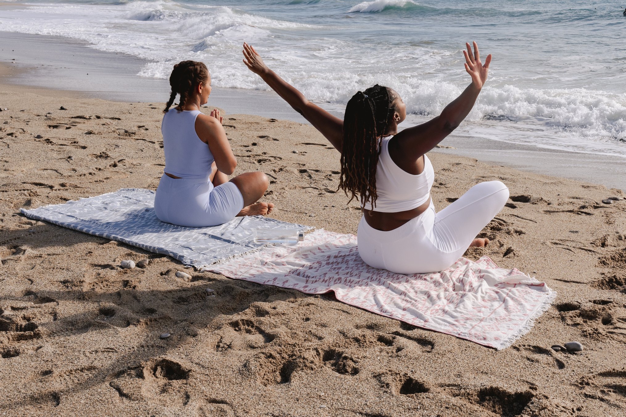 Women Meditating at the Beach